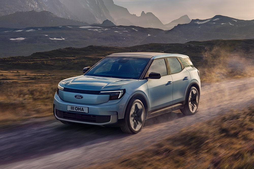 Ford Explorer driving in a mountainous landscape